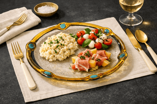 Glass dinnerware reflecting soft natural light on a refined table setting