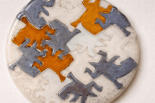 Handmade fused glass plate with amber and grey geometric forms